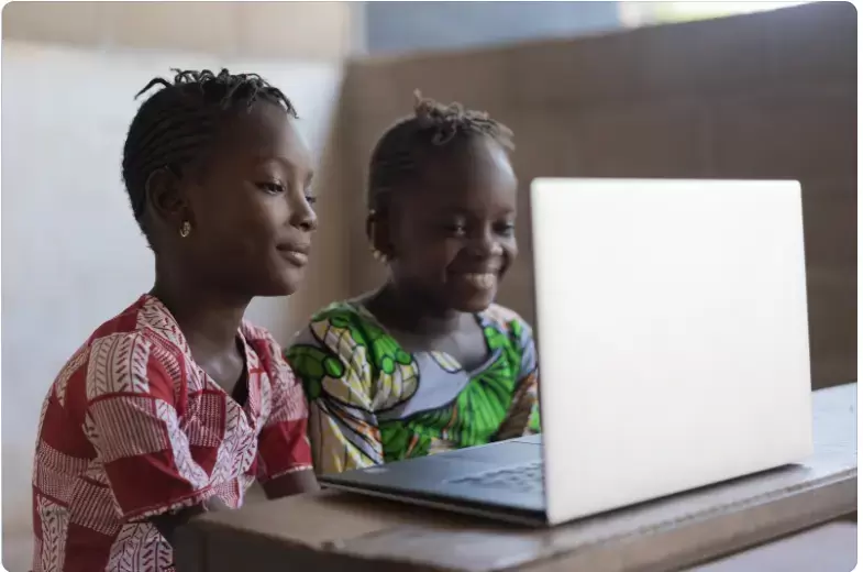 Two African girls with a laptop